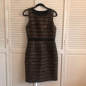 Trina Turk Dress size 6. Brown tone sticking with black edging.